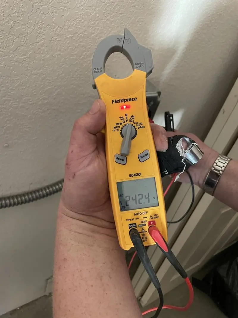 Voltage testing with clamp meter during Outlet Installation in Deer Park